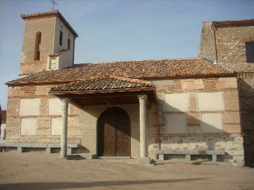 Church of Monterrubio with portico and tower in Segovia.
