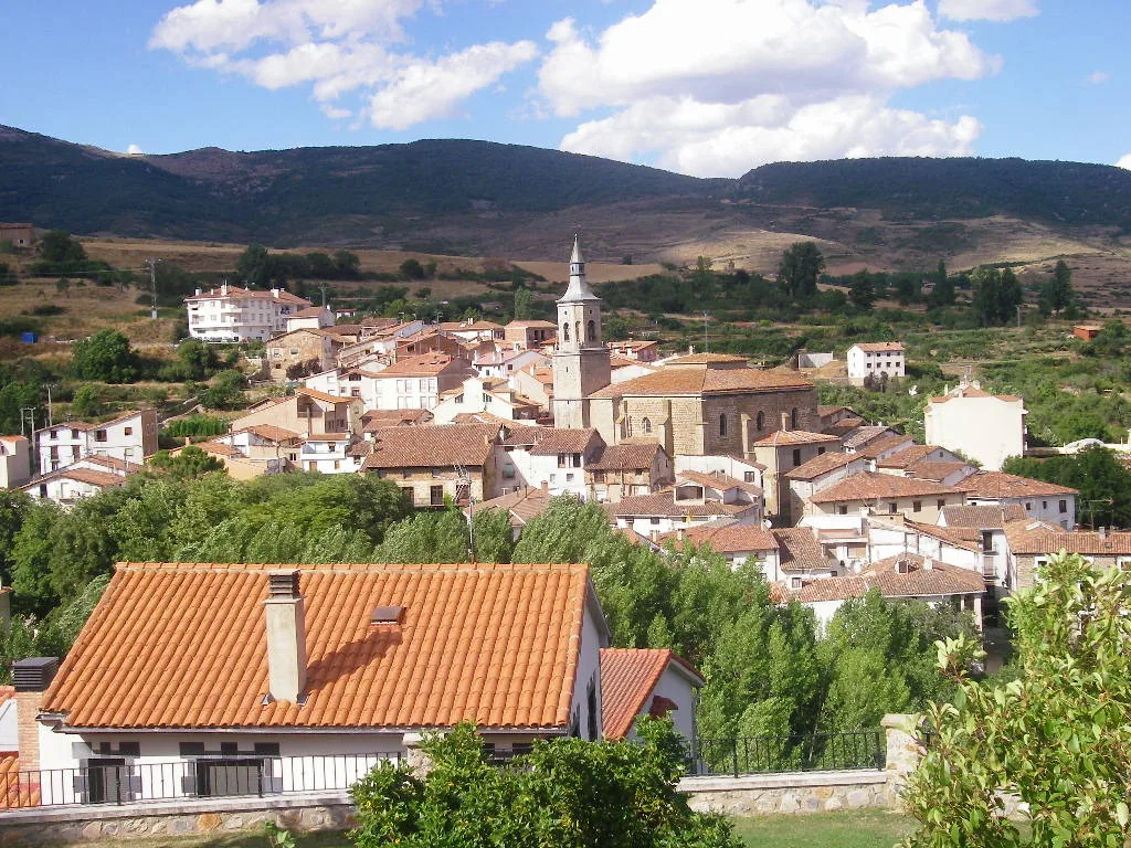 View of houses and a church in a mountain village.
