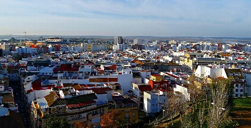 Aerial view of the city of Huelva with buildings and streets.