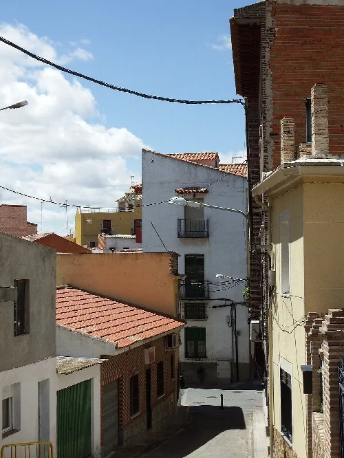 Narrow streets with colorful buildings in Cabañas de la Sagra.
