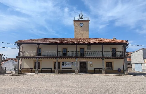 Town hall building with clock tower and balcony in Salamanca.