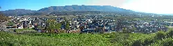 Panoramic view of Bembibre with mountains and buildings.