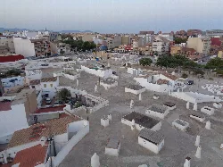 View of rooftops and buildings from a tower in Paterna.