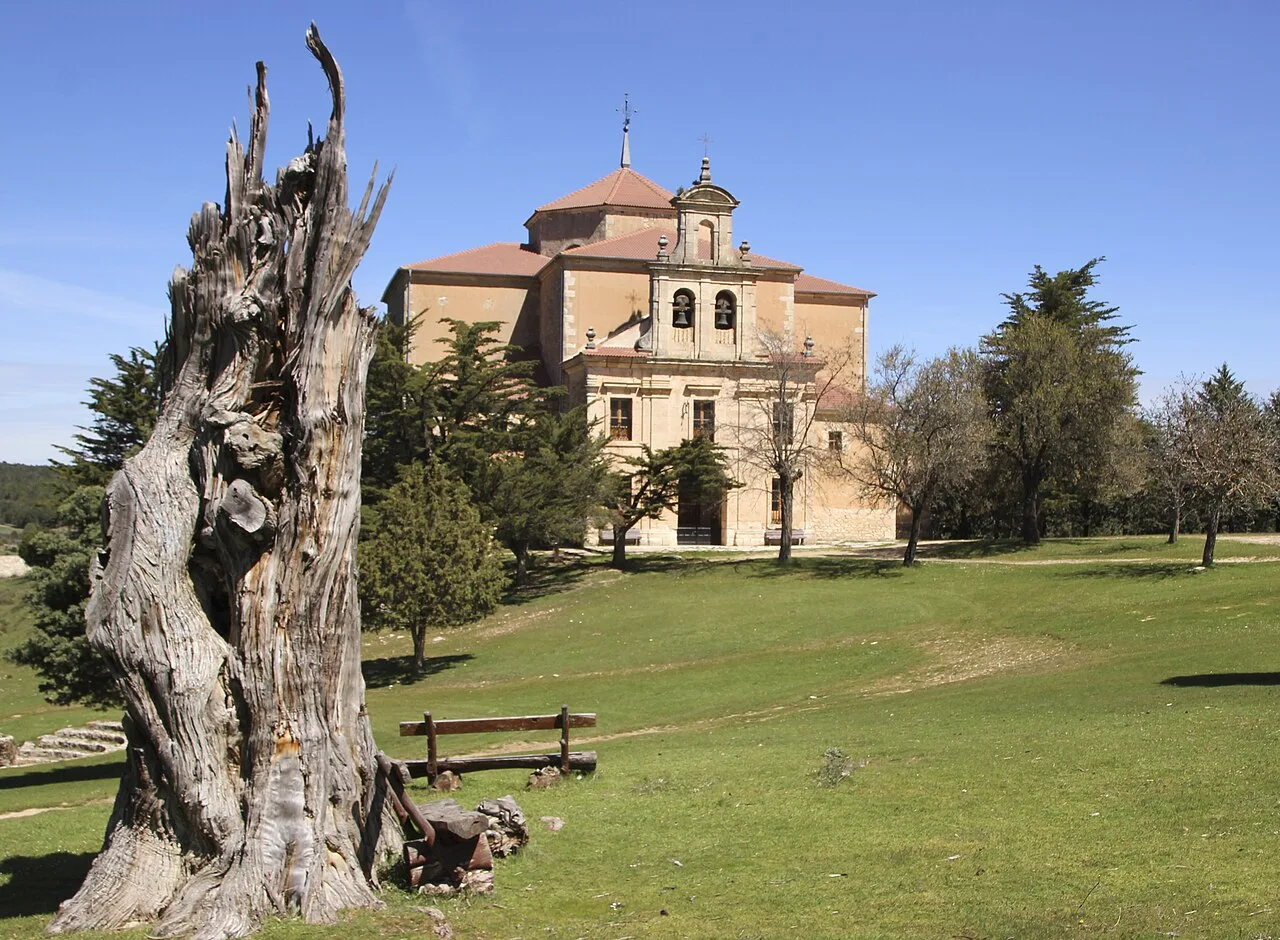 Hornuez sanctuary with trees and grass in the landscape.
