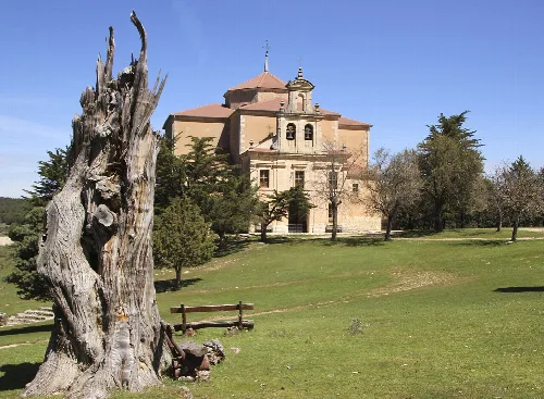 Hornuez sanctuary with trees and grass in the landscape.