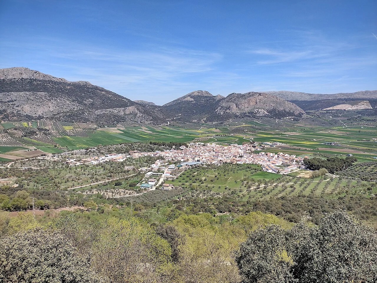View of Alfarnate, village in Málaga, surrounded by mountains and fields