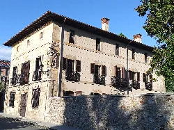 Stone building with windows and iron balconies in Elorrio.