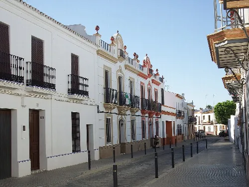 White streets with balconies in Chucena, Huelva.