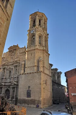 Church tower with clock and windows in Andorra, Teruel.