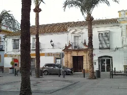 Palm trees and white buildings in Plaza de Andalucía, La Campana.
