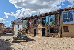 Town hall and fountain in the central square of Castrillo de la Valduerna.