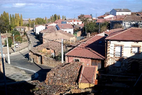 Streets and houses with red tile roofs in Torreadrada, Segovia.