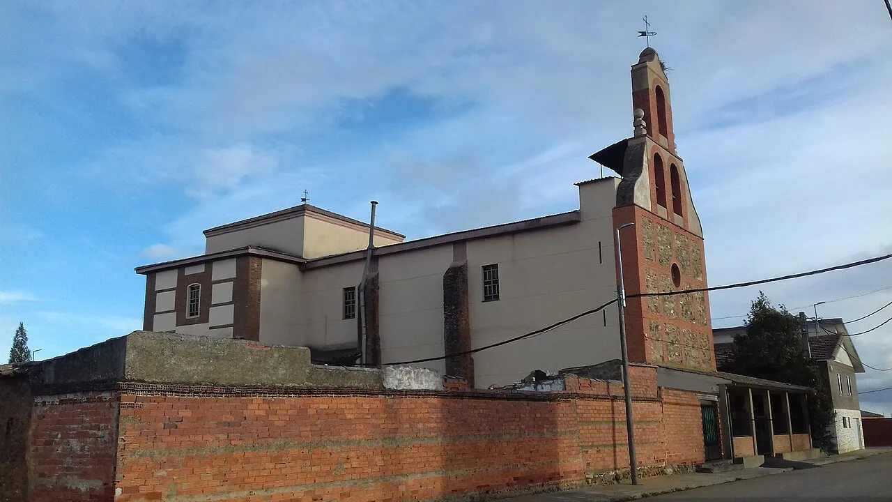 Church with tower and simple facade in Pobladura de Pelayo García.