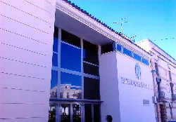 Modern facade of the municipal theater with large windows.