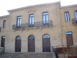 Stone building with wooden doors and windows in Berango, Vizcaya.