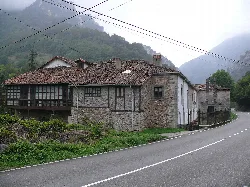 Old stone house with tiled roof in Belmonte de Miranda.