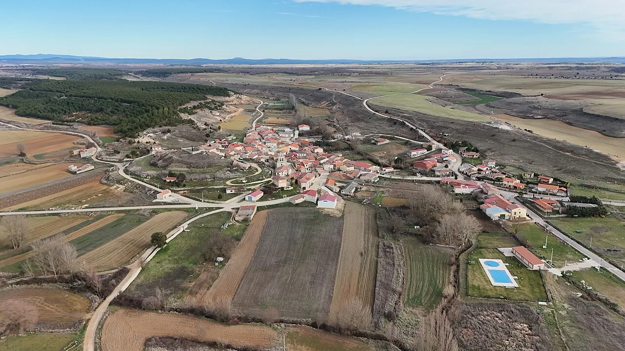 Aerial view of a village with fields and roads in Burgos.