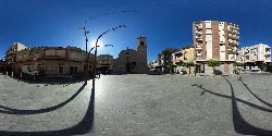 Square with buildings, church, and blue sky in Rafal, Alicante.