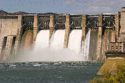 Mequinenza dam with water flowing through the gates.