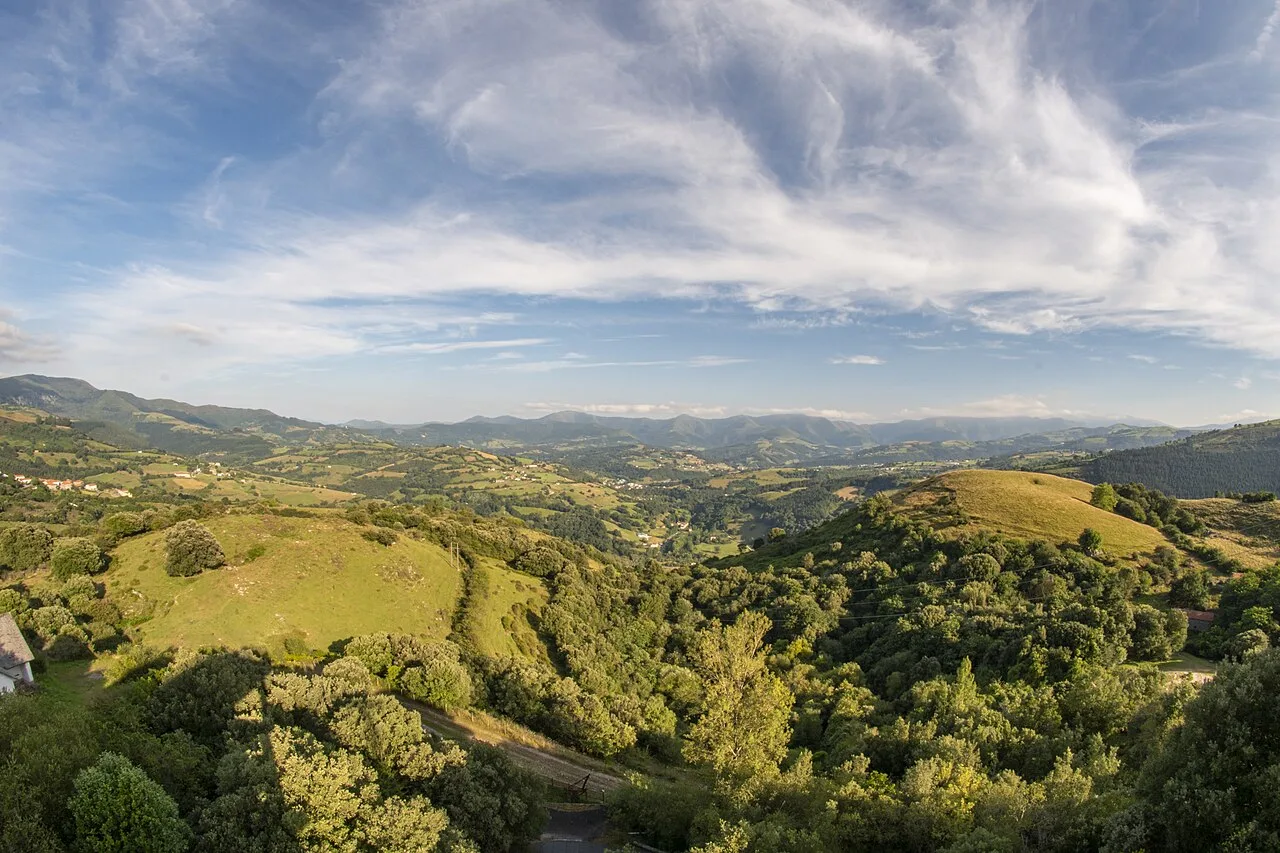 Landscape with green hills and sky with clouds in Valle de Carranza.