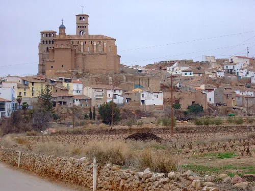 View of Aniñón village with houses and castle on the hill.