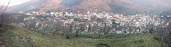 Houses in Cabezuela del Valle on a valley surrounded by mountains.