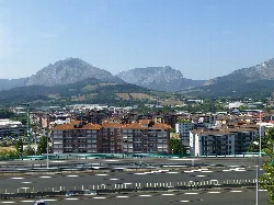 View of buildings and mountains in Abadiano, Vizcaya.