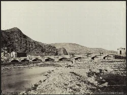 Nájera Bridge with arches and river in foreground.