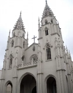 Santiago Apostle Church with tall towers and Gothic architecture.