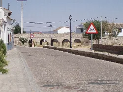 Stone bridge with arches and lampposts in Orgaz, Toledo.