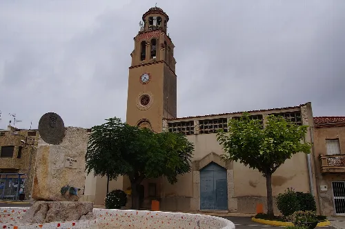 Church with tower and clock in San Rafael del Río, Castellón.
