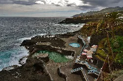 Natural pools at Charco Azul by the sea and mountains.