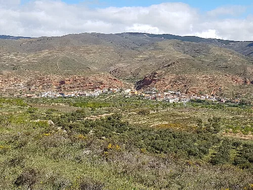 General view of Santa Eulalia Bajera, village in Spain, as seen from vía verde de Préjano.