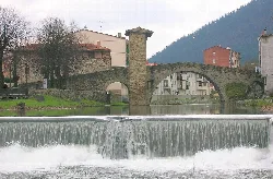 Stone bridge with an arch and a tower in Balmaseda-Valmaseda