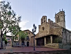 Old church with tower and stone structure in Santa Perpetua de Mogoda.